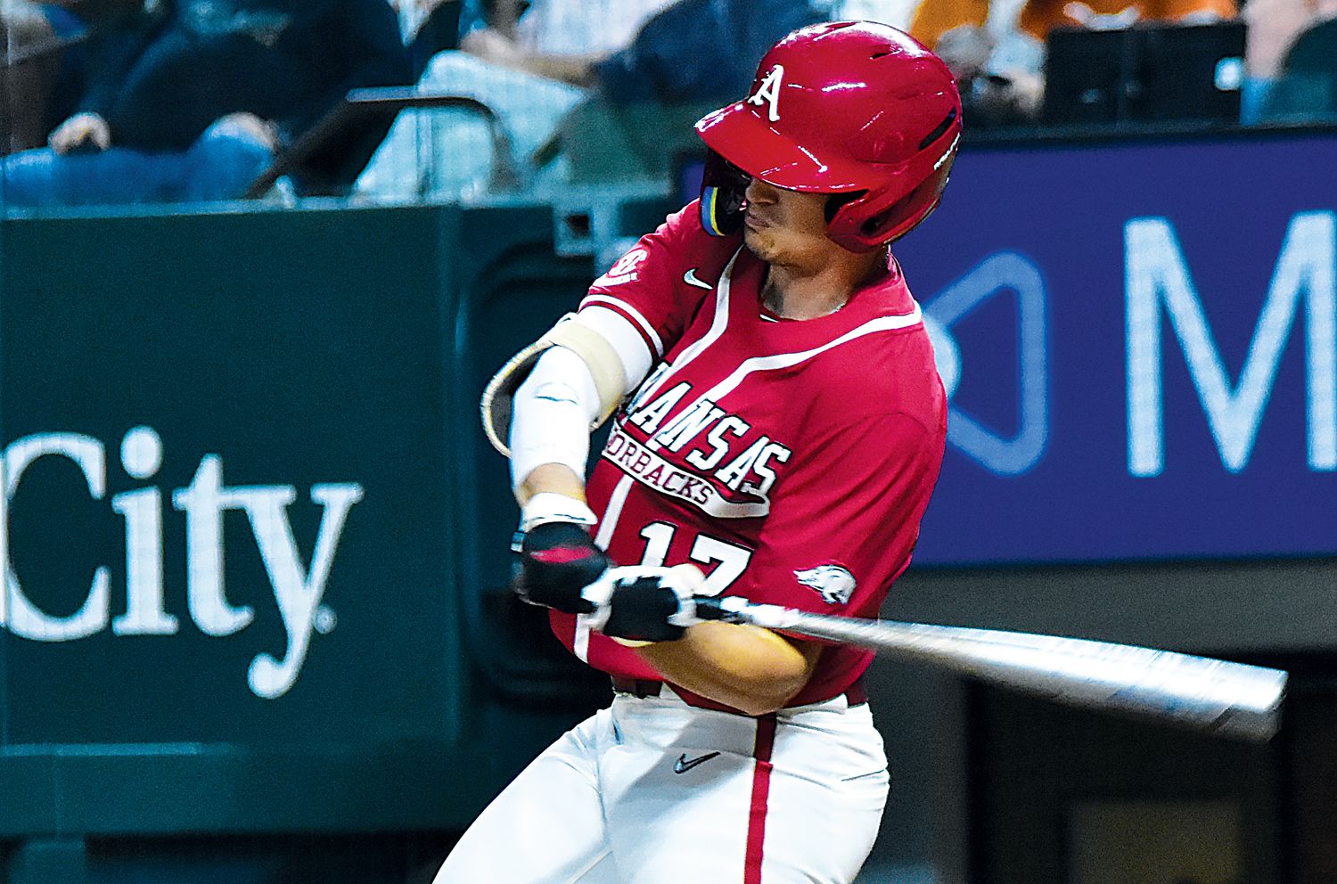 Arkansas Razorback Brady Slavens takes a cut against the Texas Longhorns at Globe Life Field.